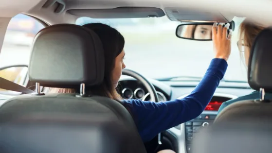 Teenager Having Driving Lesson With Female Instructor