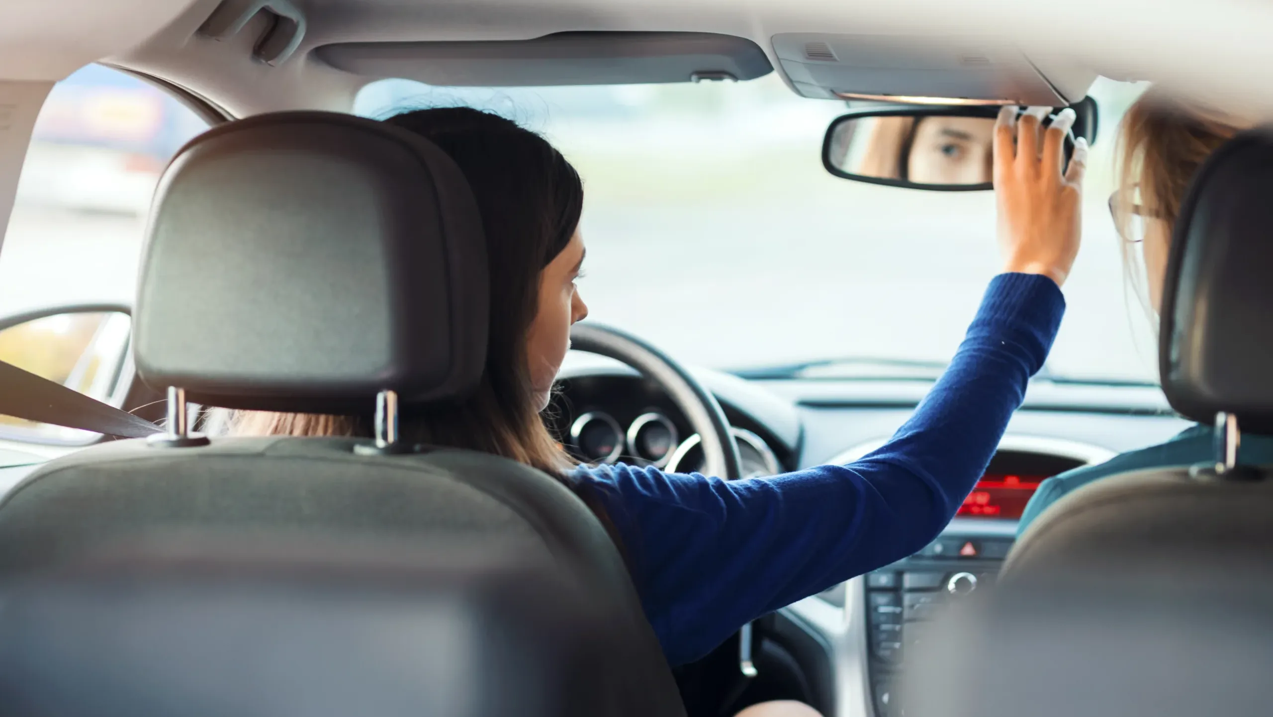 Teenager Having Driving Lesson With Female Instructor